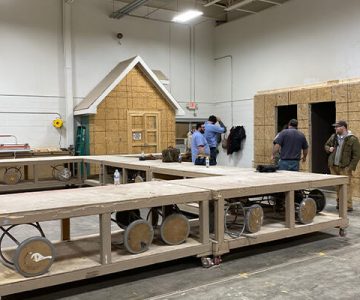 image of students learning how to build the walls and interior structures of a home