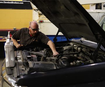 image of student working on a diesel engine in the shop