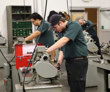 image of students working on engines
