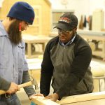 two students training in carpentry