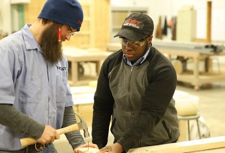 two students training in carpentry