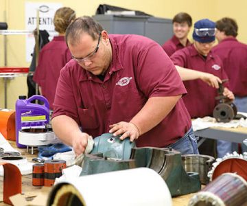 image of student using oil to lubricate engine