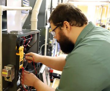 Image of students working on air system