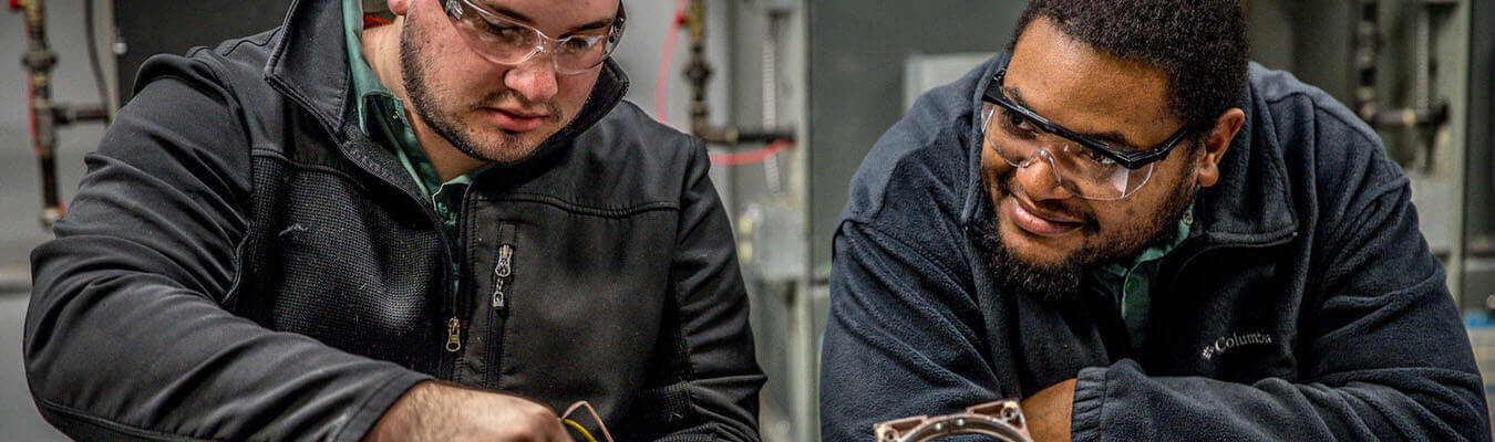 image of two NCST students working at a table