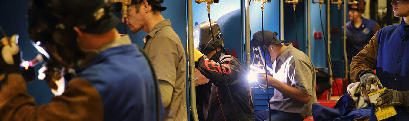 image of students working inside the welding lab at the East Liverpool Campus