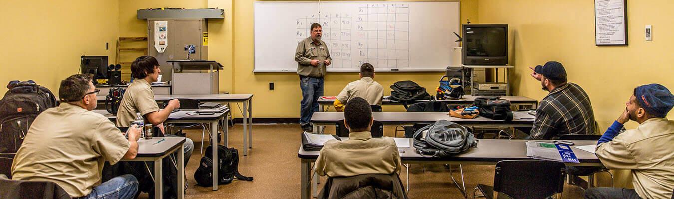 image of classroom; instructor teaching students in uniforms