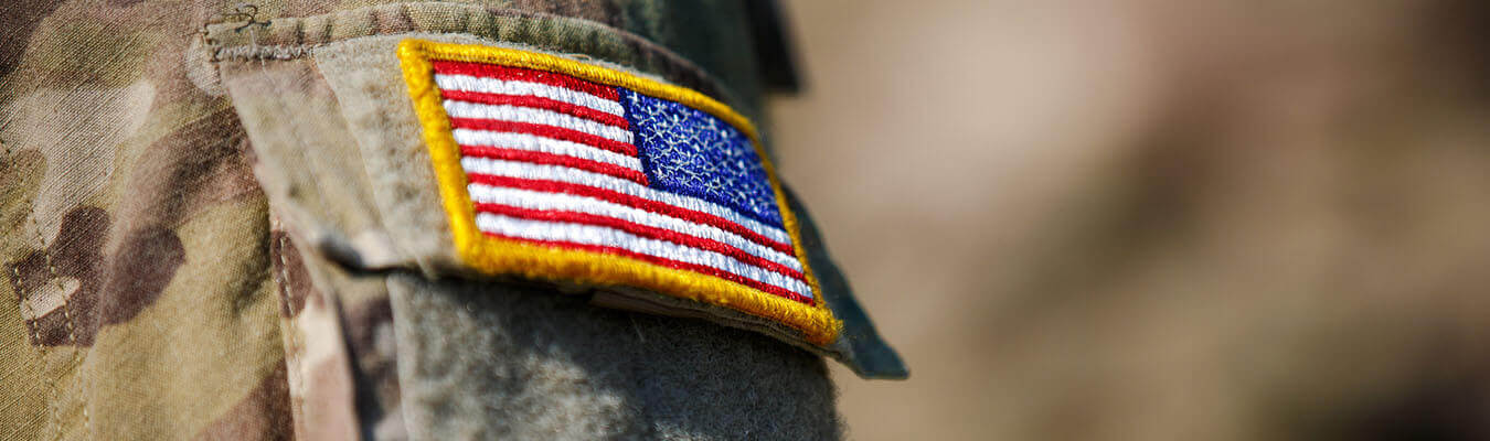 image of military uniform with American Flag patch