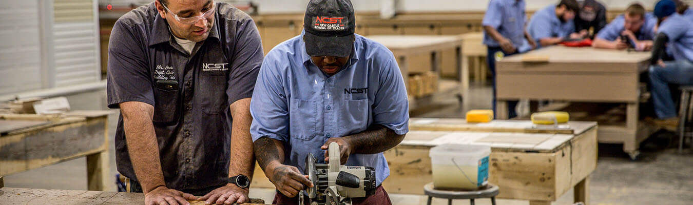 image of student and instructor working in the building technology lab at NCST