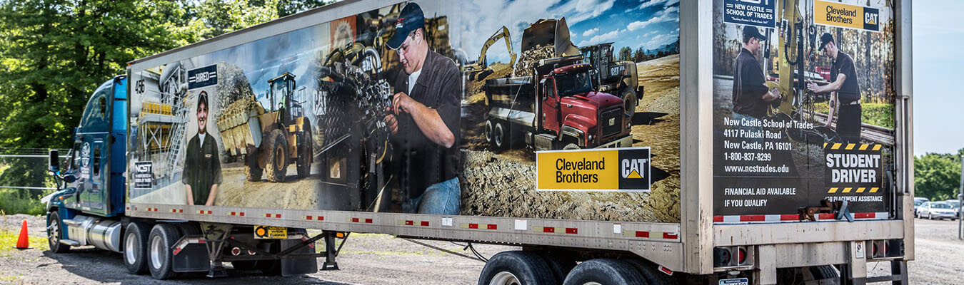 Image of new castle school of trades branded Class A semi-truck