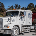 Image of red and white NCST truck.