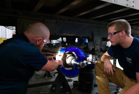 image of two diesel technology students working on a project in the training facility