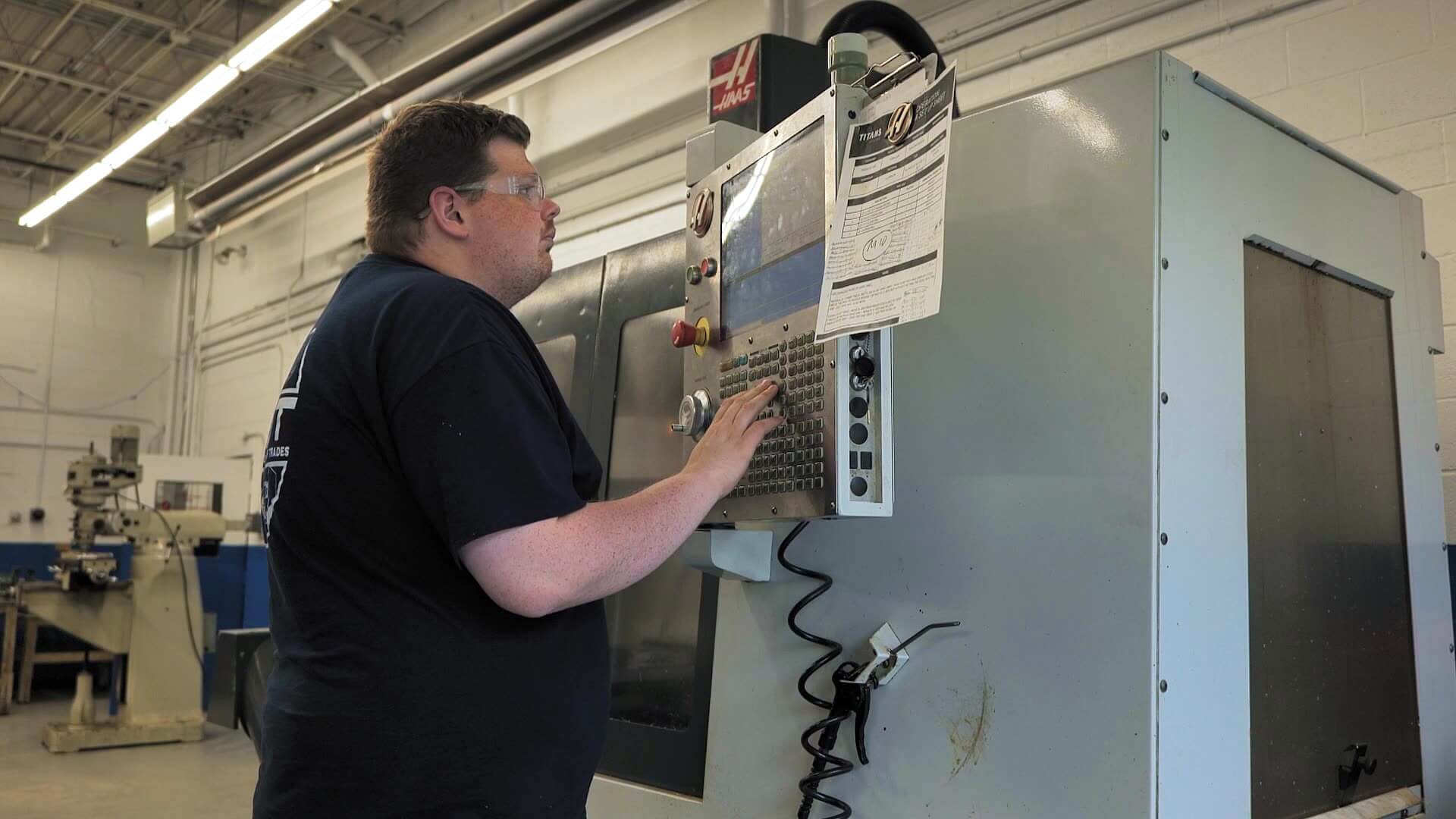 Noah Stoner working on an electrical panel