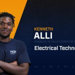 Kenneth Alli standing with arms crossed with NCST themed backdrop