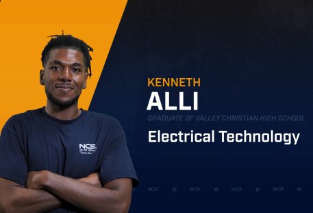 Kenneth Alli standing with arms crossed with NCST themed backdrop