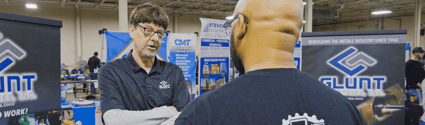 Glunt Industries employer talking to potential student at NCST Career Fair