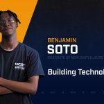 Benjamin Soto standing with arms crossed with NCST themed backdrop